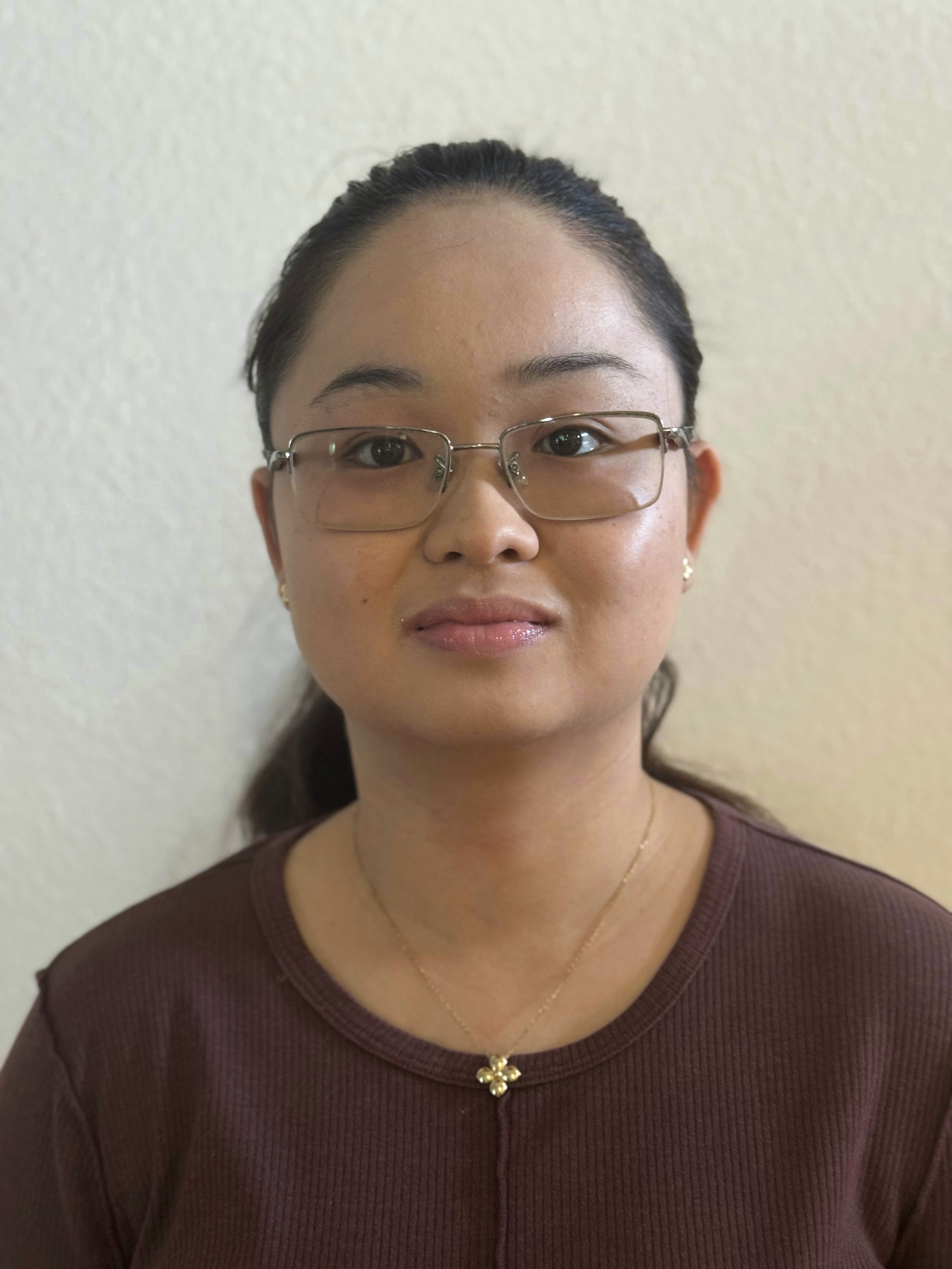 A professional headshot of Kelly Tran